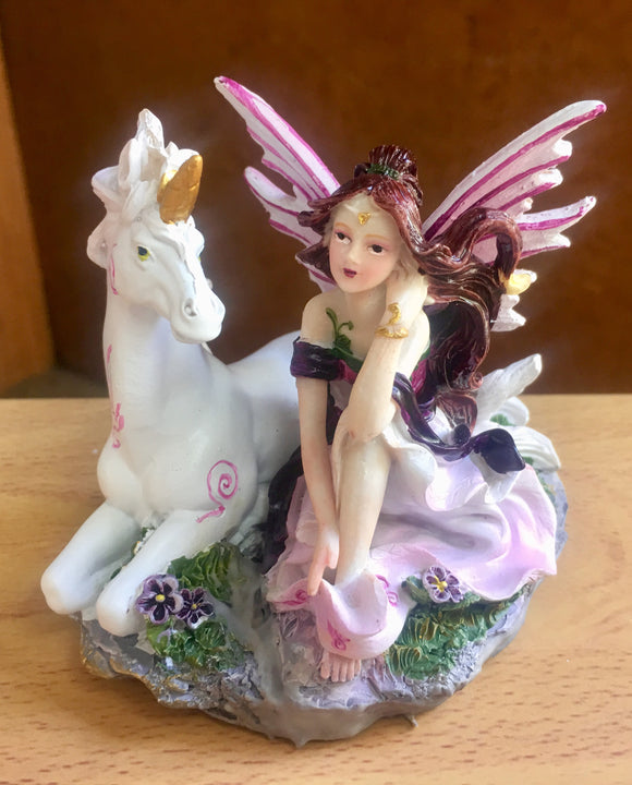 Burgundy fairy with unicorn